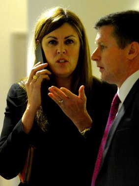 Prime Minister Tony Abbott's chief of staff Peta Credlin in the hallway of the Endeavour Hills police station after a picture opportunity.