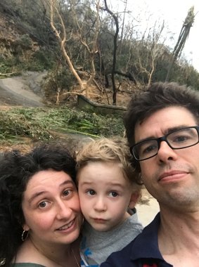 Melissa and Michael with their son on Hamilton Island in the aftermath of Cyclone Debbie.