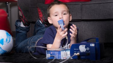 A cystic fibrosis patient uses a nebuliser to clear his airways. People with the disorder have to do this twice a day.