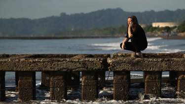 Sabine Atlaoui, the wife of French man Serge Atlaoui, at the beach in Cilacap, the closest town to Nusakabangan Prison. Nusakabangan Island is in the background.