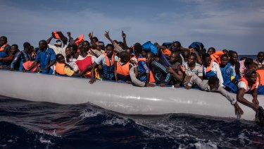 Italian sailors with the Uraniam Navy Ship rescue 109 African migrants from Gambia, Mali, Senegal, Ivory Coast, Guinea, and Nigeria, from a rubber boat in the sea between Italy and Libya.