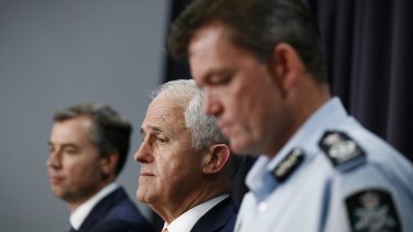 Justice Minister Michael Keenan, Prime Minister Malcolm Turnbull and AFP Commissioner Andrew Colvin address the media on Tuesday.
