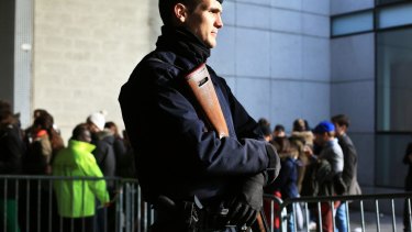 A French riot police officer stands guard at the entrance of the Stade de France prior to the Six Nations rugby match between France and Italy earlier this month. 