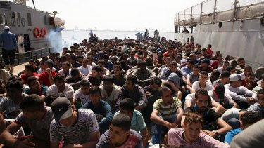 The Libyan coast guard took hundreds of migrants who were trying to reach Europe illegally by boat into custody, following an altercation with a volunteer rescue vessel. 