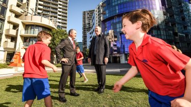 Education Minister James Merlino and Housing Minister and Albert Park MP Martin Foley with students from Port Melbourne Primary School.