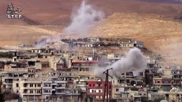 Video provided by a Syrian opposition media outlet shows smoke rising from the government forces shelling on Wadi Barada, north-west of Damascus.