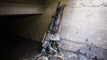 An abandoned weapon is propped against a storm drain wall, in the neighbourhood where special forces had located the world's most-wanted drug lord Joaquin "El Chapo" Guzman, in Los Mochis, Mexico, 