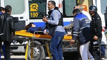 A victim is evacuated outside the Bardo Musum in Tunis.
