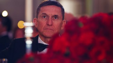 Michael Flynn listens during the presidential inaugural Chairman's Global Dinner on January 17.
