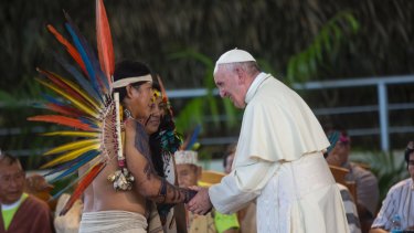 Pope Francis greets indigenous representatives in Puerto Maldonado.