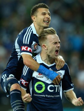 Kosta Barbarouses congratulates Conor Pain after his goal in the win against Wellington at AAMI Park on Monday night. 