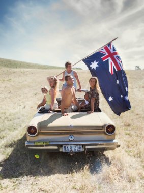 This image was taken in a paddock near Geelong this week. Shae Tweeddale (yellow singlet) said it was “heaps of fun”. But cramming into an old car with a fl agpole may not be the safest activity. Tweeddale says she will be spending the national holiday with friends in Barwon Heads.