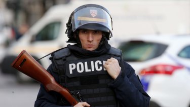 Military and police conduct an operation in Saint-Denis on Wednesday.