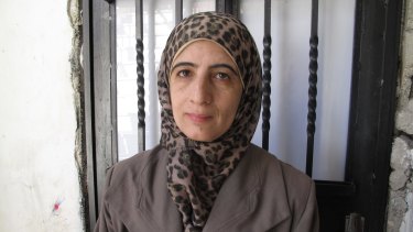 Enas al-Shalodi, mother of alleged Jerusalem vehicle attacker Abdel Rahman al-Shalodi, outside her demolished home.