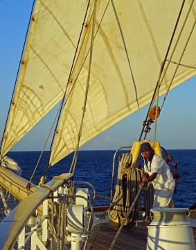 A crew member at work on the sails of Star Clipper.