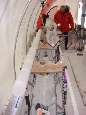 Tas van Ommen with an ice core in a drill tent.