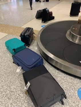 Luggage fallen from the overloaded baggage carousel at Sydney Airport.