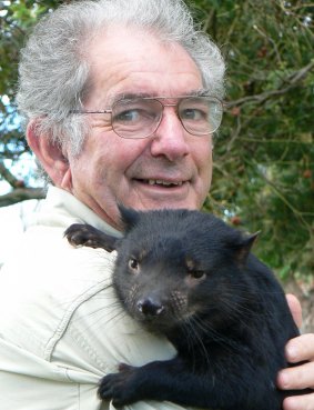 Bruce Englefield with a Tasmanian devil joey.