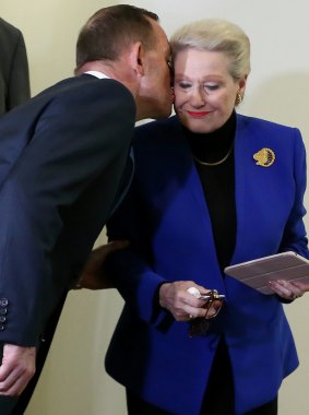Prime Minister Tony Abbott kisses Mrs Bishop after the party room meeting where Mr Smith was elected Speaker.