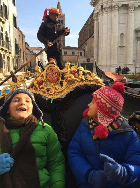 Taking a Gondola ride through Venice.