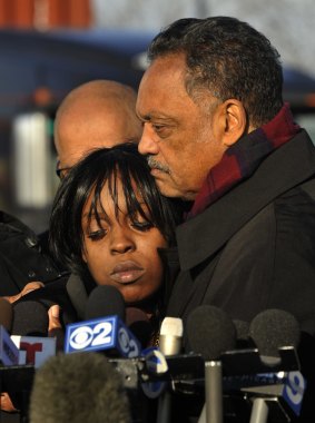 Reverend Jesse Jackson, right, comforts Laquan McDonald's aunt Tanisha Hunter during a vigil for the 17-year-old McDonald on Tuesday in Chicago. 