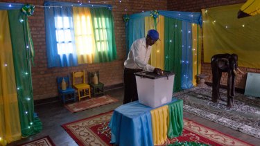 Rwandans start to vote in a polling station in Rwanda's capital Kigali on Friday.