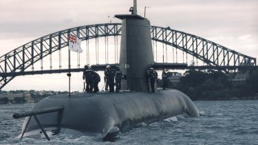 A Collins Class submarine sails through Sydney Harbour.