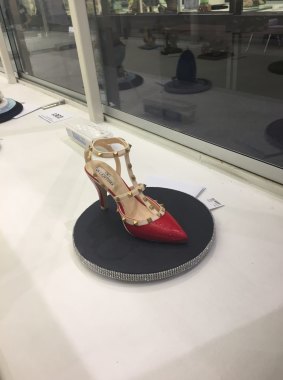 An extravagant piece of 'sugar art' fashioned into the shape of the iconic Valentino Rockstud stiletto can be seen at the show.