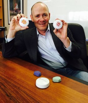 Geoff Elwood, from Melbourne-based developer company Specialist Apps, with severals iBeacons. The round ones are Australian-made BlueCat beacons.