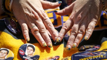 Footy fans were decked from head to finger tips in their team colours at the parade.