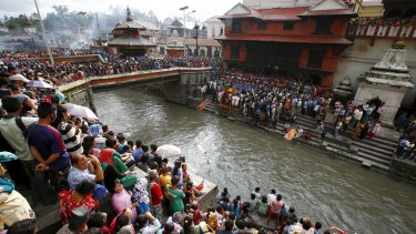 People gather to observe the cremation of Senior Superintendent of Police Laxman Neupane.