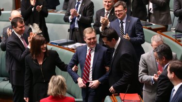 Speaker Tony Smith is dragged to the chair by Lucy Wicks and Michael Sukkar following his election in 2015.