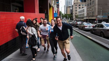 Dave Eastham and his team take off for their Amazing Race-style Urban Quest competition on La Trobe Street. 