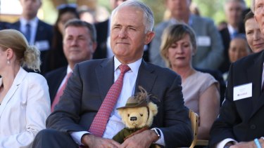 Prime Minister Malcolm Turnbull holds Trooper Jones, the light horse fundraising bear, during a visit to Soldier On in Canberra on Friday. 