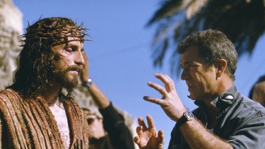 Cross to bear ... Jim Caviezel, who portrays Jesus, talks with Gibson on the set of The Passion of The Christ.
