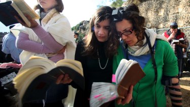 Members of Women of the Wall pray at the Western Wall wearing prayer shawls and phylacteries or prayer boxes, both of which Orthodox Judaism regard as solely for men.