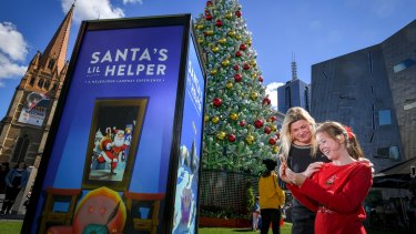 Georgina Way and her daughter Phoebe from the Mornington Peninsula try out the Santa's Lil Helper app.