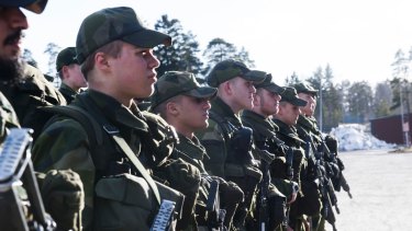 Young Swedish army recruits during an inspection in March.