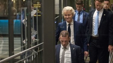 Geert Wilders, leader of the Freedom Party (PVV), centre, leaves the Dutch Parliament following the election.