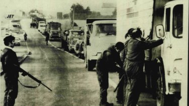 British Security forces halt traffic on highway leading to the Northern Ireland border town of Newry in 1972.