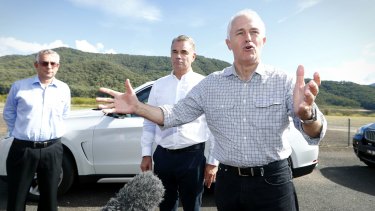 Prime Minister Malcolm Turnbull with Snowy Hydro CEO Paul Broad (centre) before taking a tour of the region via helicopter during his visit to the Snowy Hydro at Talbingo, NSW, on Thursday.