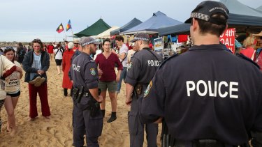 Police move on the beach towards the end of the protest.  