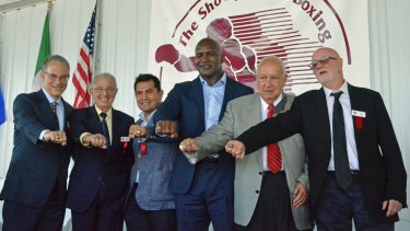 Prestigious company: International Boxing Hall of Fame Class of 2017 inductees (from left) Steve Farhood, Barry Tompkins, Marco Antonio Barrera, Evander Holyfield, Jerry Roth and Johnny Lewis display their rings following the induction ceremony in Canastota, New York.
