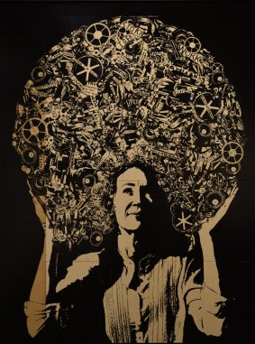 James Powditch's portrait features Cath Keenan wearing what appears to be an afro filled with cogs and the words of children at the Sydney Story Factory.