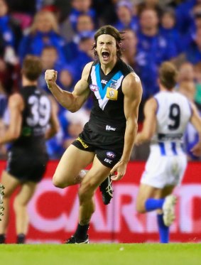 Jasper Pittard of the Power celebrates after kicking a goal last weekend against North Melbourne.