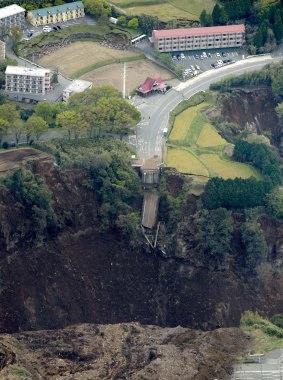 A bridge is cut off by landslides after the earthquake in Minamiaso, Kumamoto.