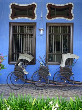 Rickshaws outside the Cheong Fatt Tze Mansion Hotel.