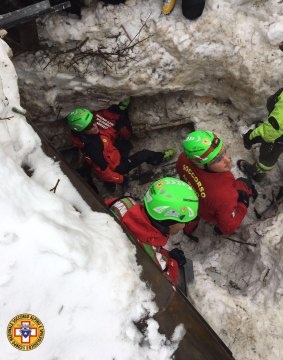Rescuers at work on the site of the Rigopiano Hotel, buried beneath more than five metres of snow.
