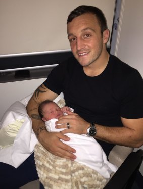 Josh Hodgson with newborn son George.