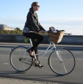 Chic cycling: a morning commuter on Queen Louise's Bridge in Copenhagen. 